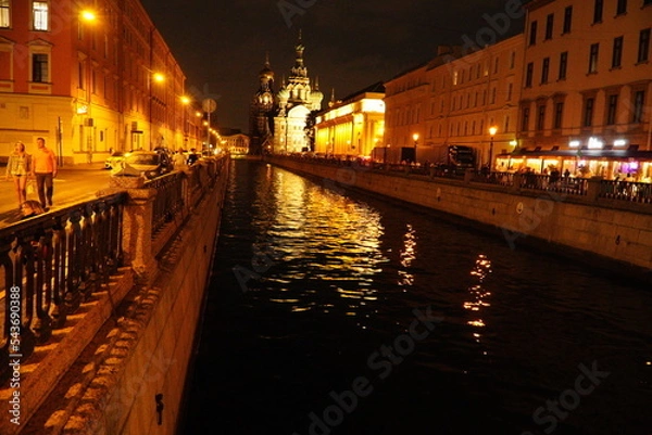 Fototapeta Beautiful night street with lighting in St. Petersburg. Saint Petersburg, Russia - August 20, 2022: