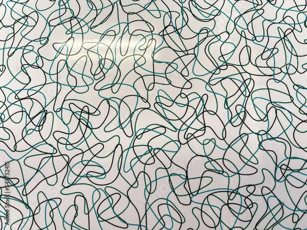 Obraz A mid century modern black and turquoise shapes on a white background table top.