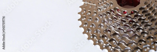 Fototapeta Banner with a rear cassette bike part in a mountain bike. Concept of the transport component on a light background