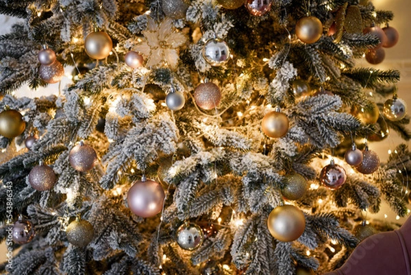 Fototapeta beautiful Christmas toys on the Christmas tree in the snow