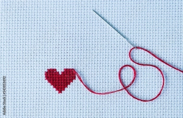 Fototapeta Heart wave embroidered with red thread on white cross stitch