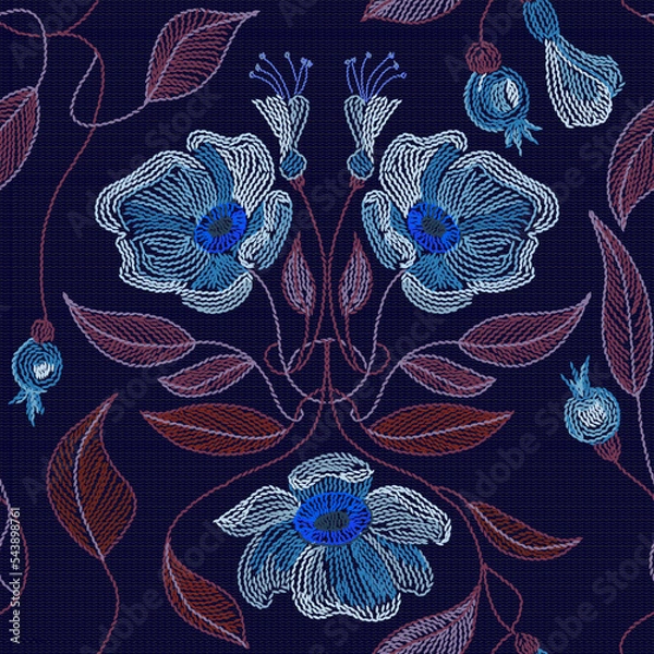 Obraz Embroidered flowers and leaves ornament on a dark background.