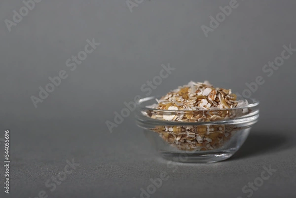 Obraz glass bowl of oatmeal isolated on gray background
