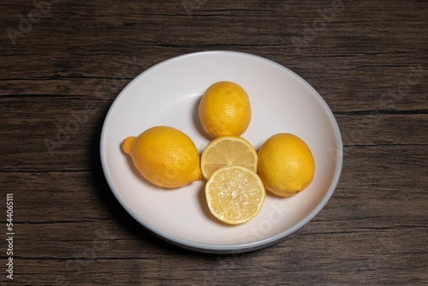 Fototapeta Lemons on a plate