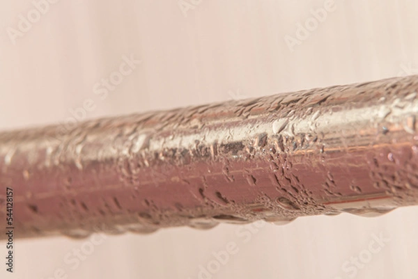Obraz condensate on a steel pipe. Water accident and leak concept