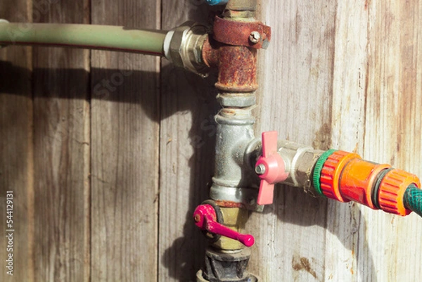 Obraz Water taps mounted on pipes and hoses
