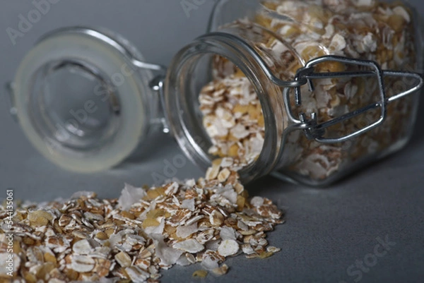 Obraz glass can of oatmeal isolated on gray background