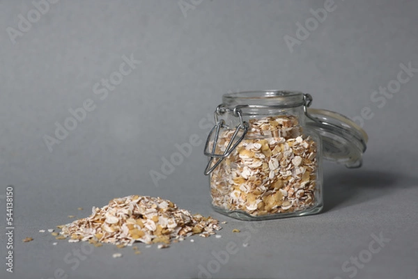 Obraz glass can of oatmeal isolated on gray background