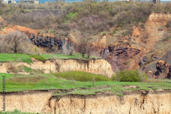 Fototapeta Soil erosion, sliding, and caving. Inside the landslide is rock. Consequences of underground mining - ground failure.