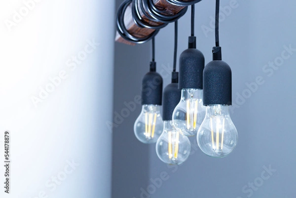 Obraz The lamp on the ceiling of the light bulbs located on the wires.
