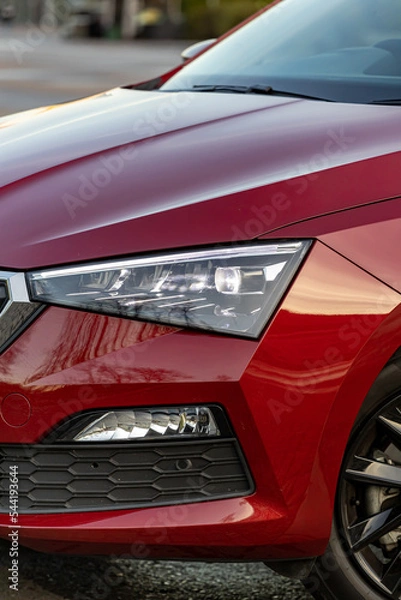 Fototapeta Headlights and fog lights of the red car.  vertical