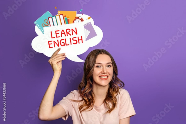 Fototapeta student girl holding speech bubble with text learn english and illustration isolated on lilac background