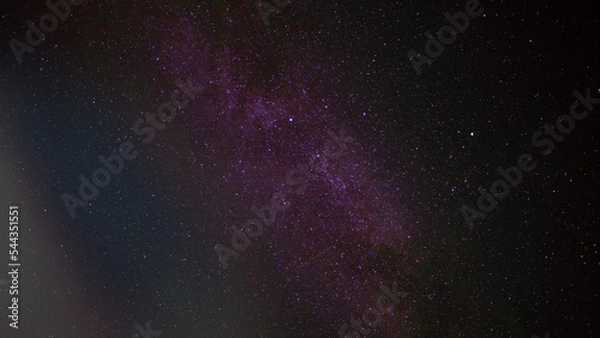 Fototapeta Milky Way and silhouette of tree at Phu Hin Rong Kla National Park,Phitsanulok Thailand, Long exposure photograph.with grain 