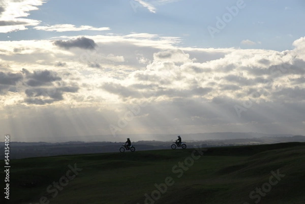 Fototapeta the rolling hills of Burton Dassett with the remains of an old windmill standing as a beacon on the summit