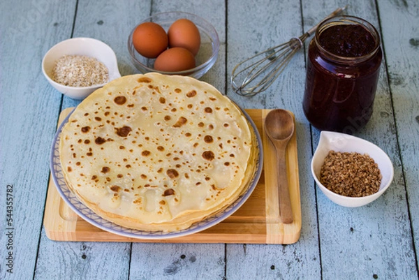 Obraz Thin pancakes on blue rustic table