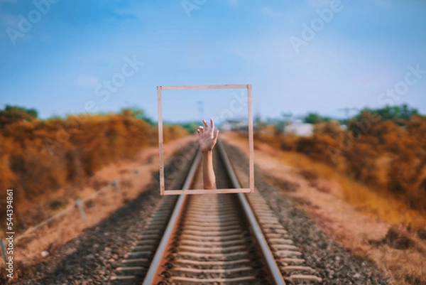 Fototapeta Picture framed artwork with hands popping up.