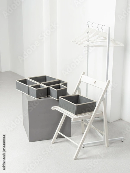Fototapeta Set of laundry organizers for wardrobe of different sizes. Concept of order in house. Empty gray closet organizers drawer divider. Dressing room. Vertical
