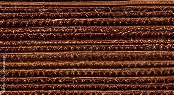 Fototapeta Brown textile texture background of a scratchy burlack material in an even light brown color.