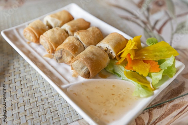 Fototapeta Fried spring rolls and plum sauce, ready to eat