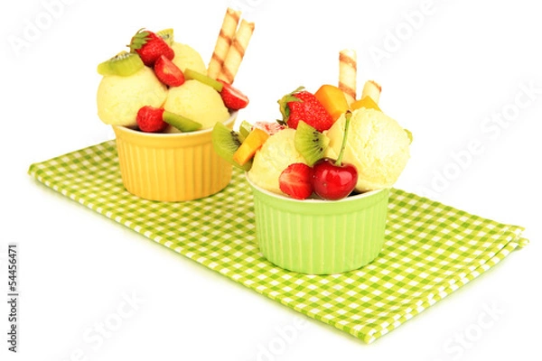 Fototapeta Delicious  ice cream with fruits and berries in bowl isolated