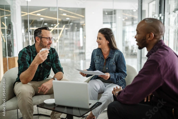 Fototapeta Casual meeting of smiling diverse business team