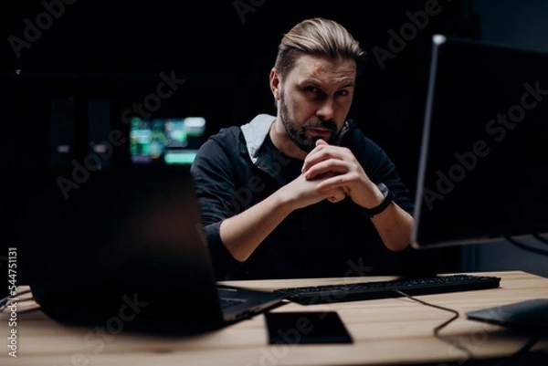 Obraz Skillful hacker working on computers