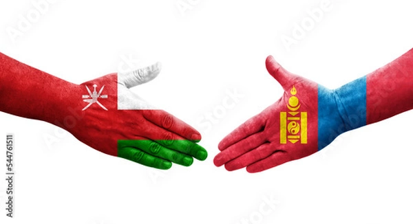 Fototapeta Handshake between Mongolia and Oman flags painted on hands, isolated transparent image.