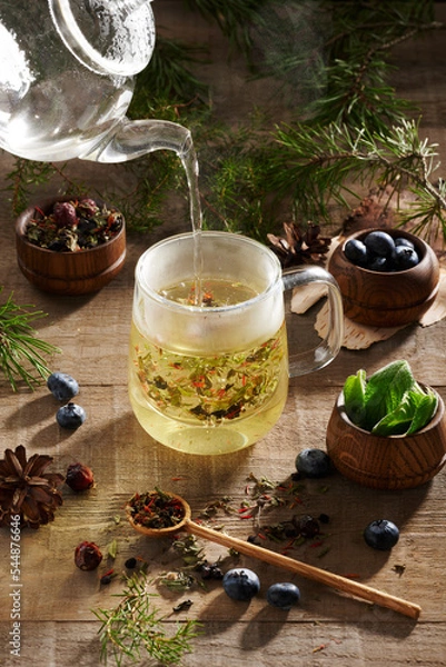 Obraz herbal tea with blueberries and rosehip