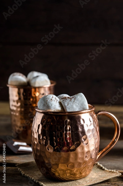 Obraz The dessert food vintage style : The Marshmallow with hot chocolate in copper cup on the wooden table. Background copy space for copy text