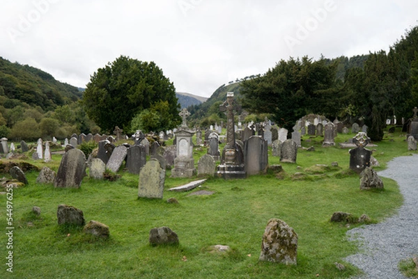 Fototapeta Monastic cemetery of Glendalough, Ireland. Ancient monastery in the wicklow mountains with a beautiful graveyard from the 11th century