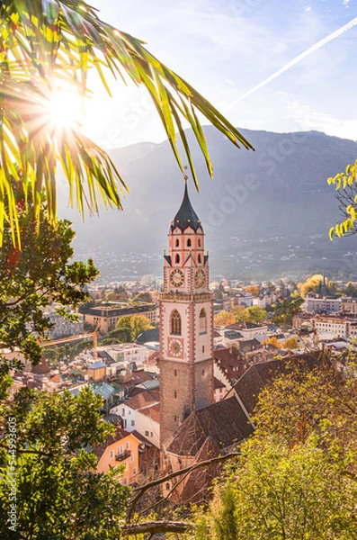 Fototapeta View over cityscape with Cathedral Saint Nikolaus of Merano, South tyrol, Italy seen from famous hiking trail Tappeinerweg