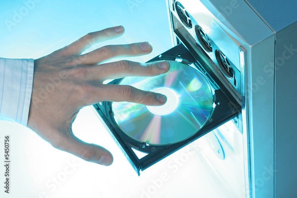 Obraz Inserting a CD-ROM into a personal computer 