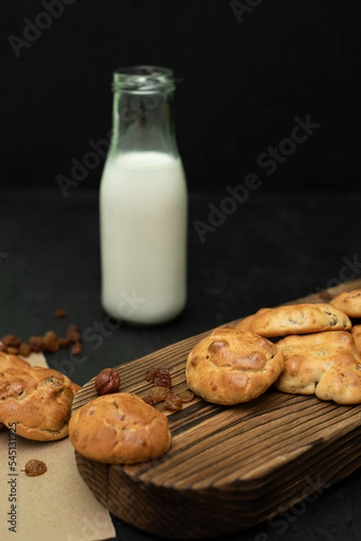 Obraz Homemade biscuits with milk. Biscuits with raisins and nuts.