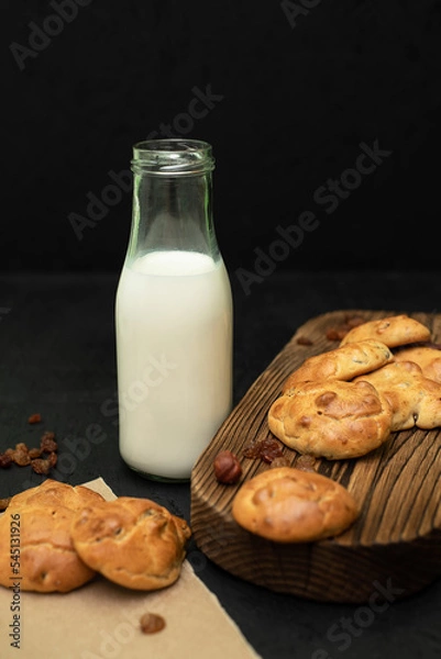 Obraz Homemade biscuits with milk. Biscuits with raisins and nuts.