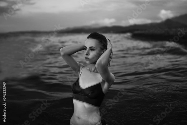 Obraz Black and white portrait of a sexy beautiful woman in the sea. Natural beauty of a young pretty girl with sexy body, clean skin and dark hair.