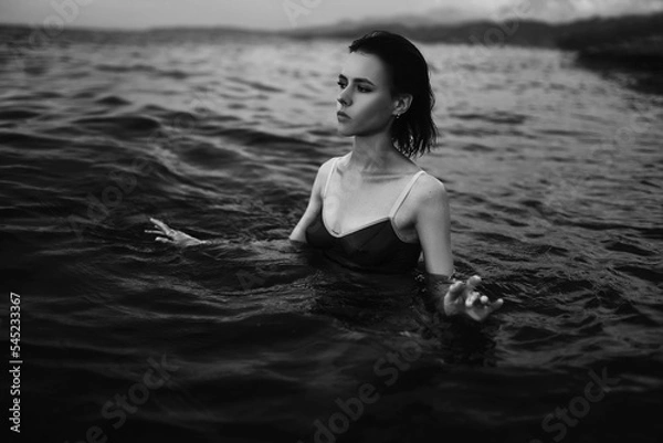 Obraz Black and white portrait of a sexy beautiful woman in the sea. Natural beauty of a young pretty girl with sexy body, clean skin and dark hair.