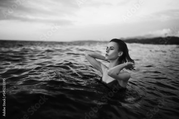 Obraz Black and white portrait of a sexy beautiful woman in the sea. Natural beauty of a young pretty girl with sexy body, clean skin and dark hair.