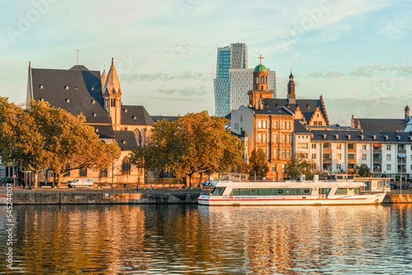 Fototapeta Frankfurt am Main, Germany - October 17th, 2022: Beautiful view to historic old town and modern buildings in the city of Frankfurt am Main where historic and contemporary architecture meet.