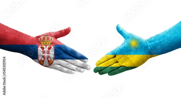Fototapeta Handshake between Rwanda and Serbia flags painted on hands, isolated transparent image.