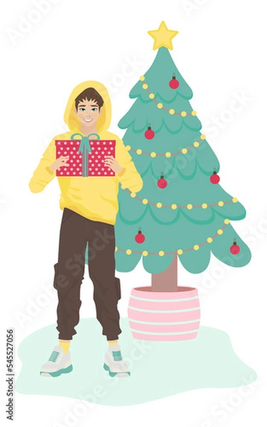 Fototapeta A young man with a New Year's gift in front of a Christmas tree. Funny cartoon character is preparing for Christmas. The guy gives a gift for the New Year. Flat vector illustration. Christmas sale