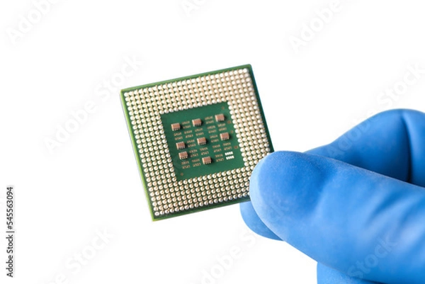 Fototapeta Hand holds electronic circuit board with processor isolated on white