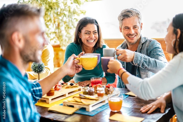 Fototapeta Friends group toasting cups at coffee bar rooftop - Mixed age range people talking and having fun together at cappuccino restaurant - Life style concept with happy men and women at cafe terrace