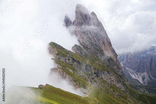 Fototapeta Wonderful and famous dolomite mountains: View to Odles group on a cloudy day. Specacular view from seceda peak. picturesue landscape in south tyrol, italy, garda valley. puez odles nature park.	