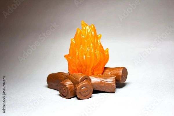 Obraz Plastic figurine bonfire with bokeh effect