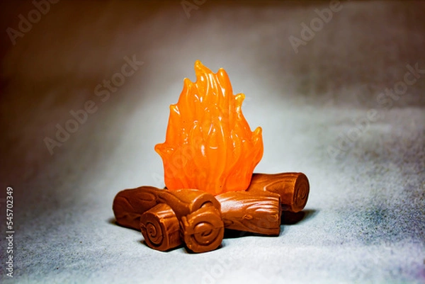 Obraz Plastic figurine bonfire with bokeh effect