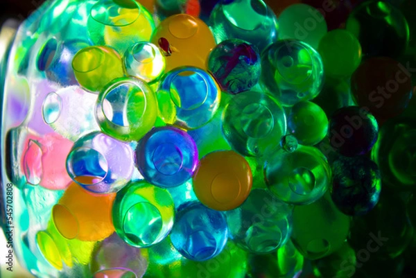 Fototapeta Colored balls in a glass with bokeh effect