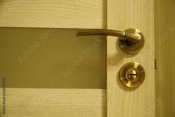 Fototapeta Exterior door handle and Security lock on Metal frame. Door handle with lock in the door