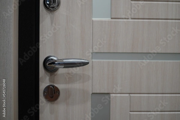 Fototapeta Exterior door handle and Security lock on Metal frame. Door handle with lock in the door