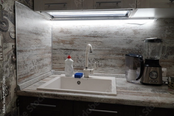 Fototapeta Electric food processor on kitchen countertop, kitchen sink on the background. kitchen applience concept