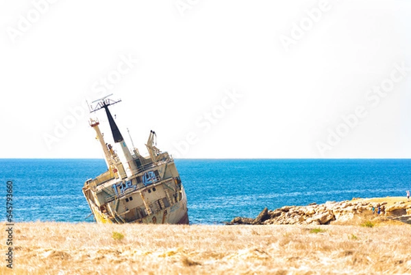 Fototapeta A large cargo ship that ran aground in the Sea Caves area of Paphos County, near Coral Bay, during a storm on December 8, 2011 after an engine failure.